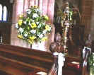 A view of the beautiful hand carved Victorian pews with "Polly" the Eagle Lecturn.  The lecturn masqueraded as a money box during 1649 - 1660.